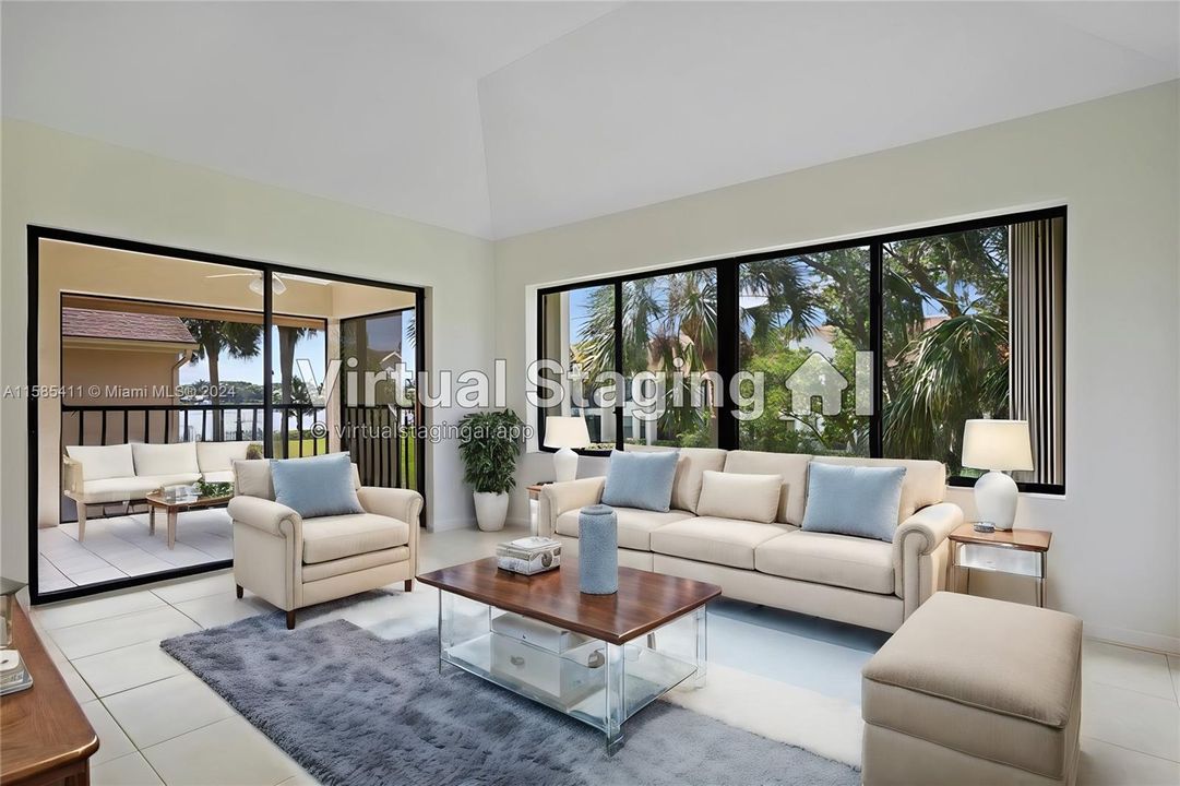 Virtual staged Living room with river views and large screened porch.