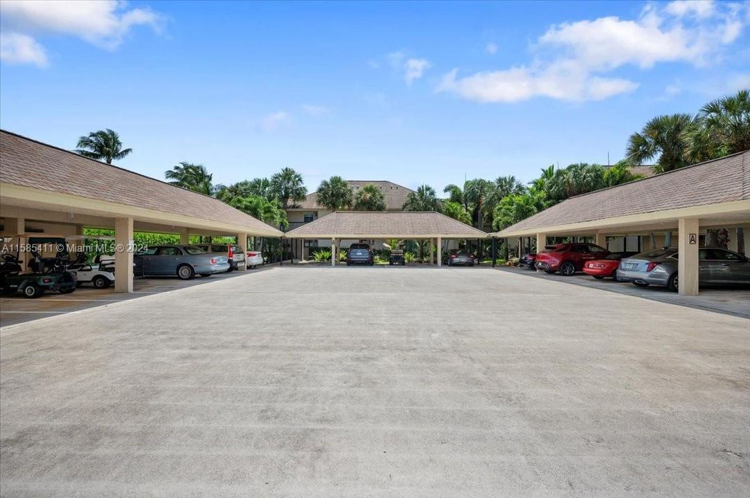 Covered parking for 2 cars, plus storage room and golf cart parking spot