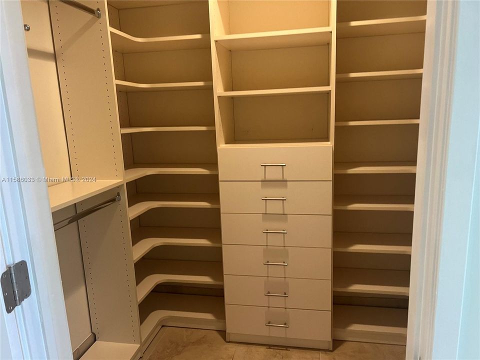 one of 2 master closets