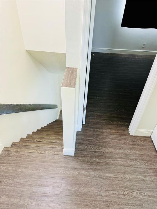 Laminate Wood Flooring stairs and entire 2nd floor