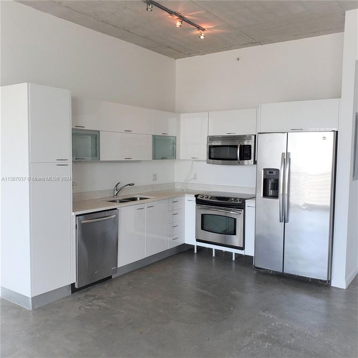 Open Kithen with stainless steel appliances