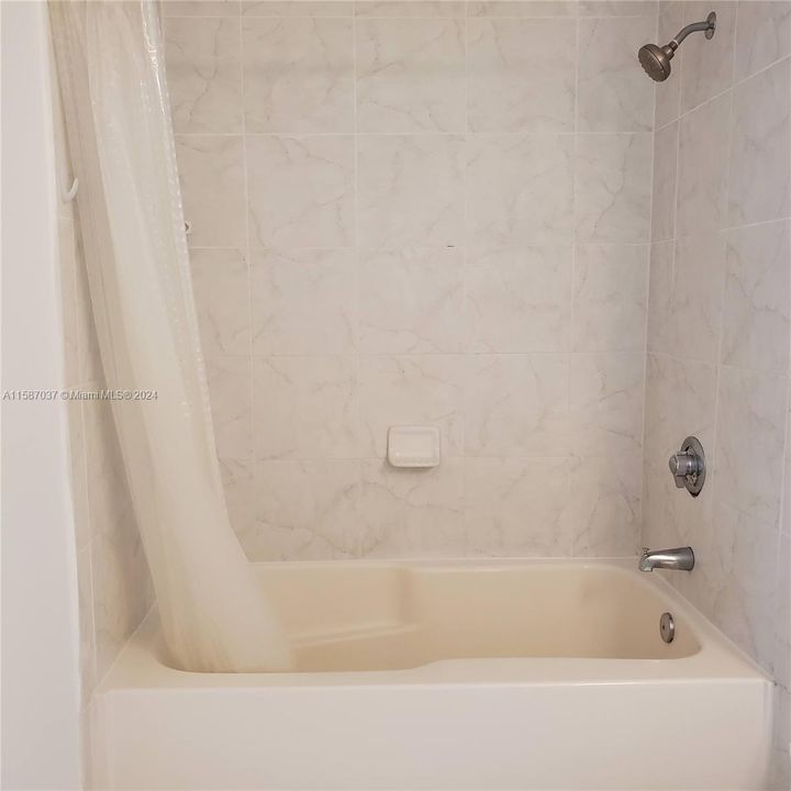 Bathroom has a combination tub/shower