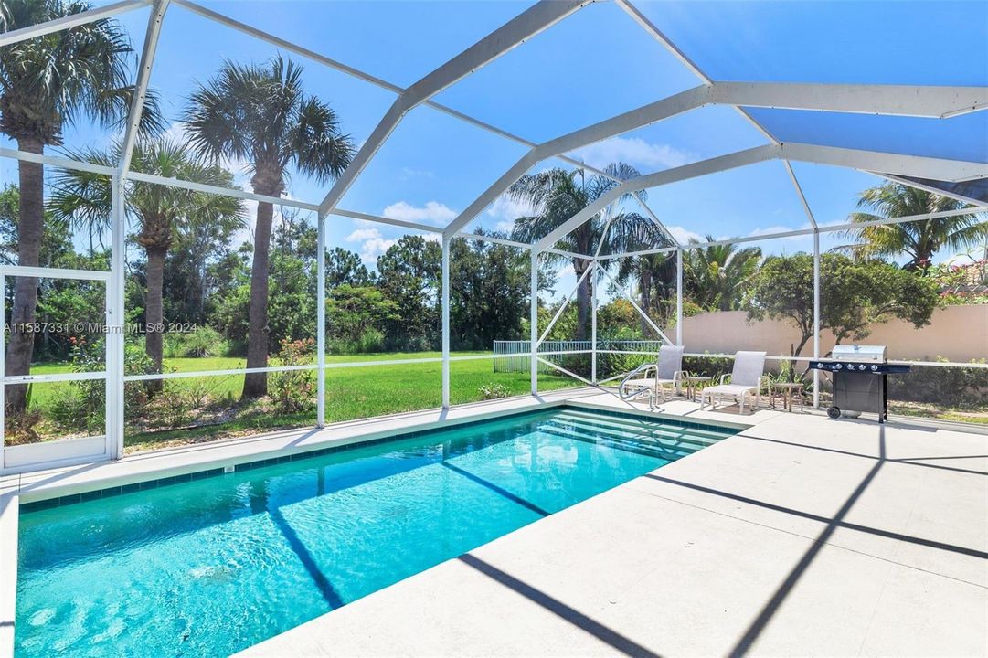 Saltwater, heated pool with a spacious lanai on a private lot surrounded by nature!