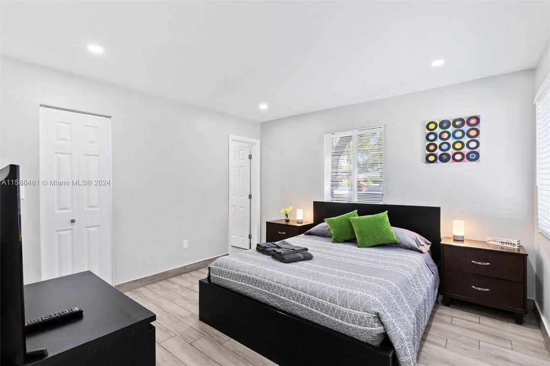 Generous master bedroom with walking closet, remodeled bathroom and windows