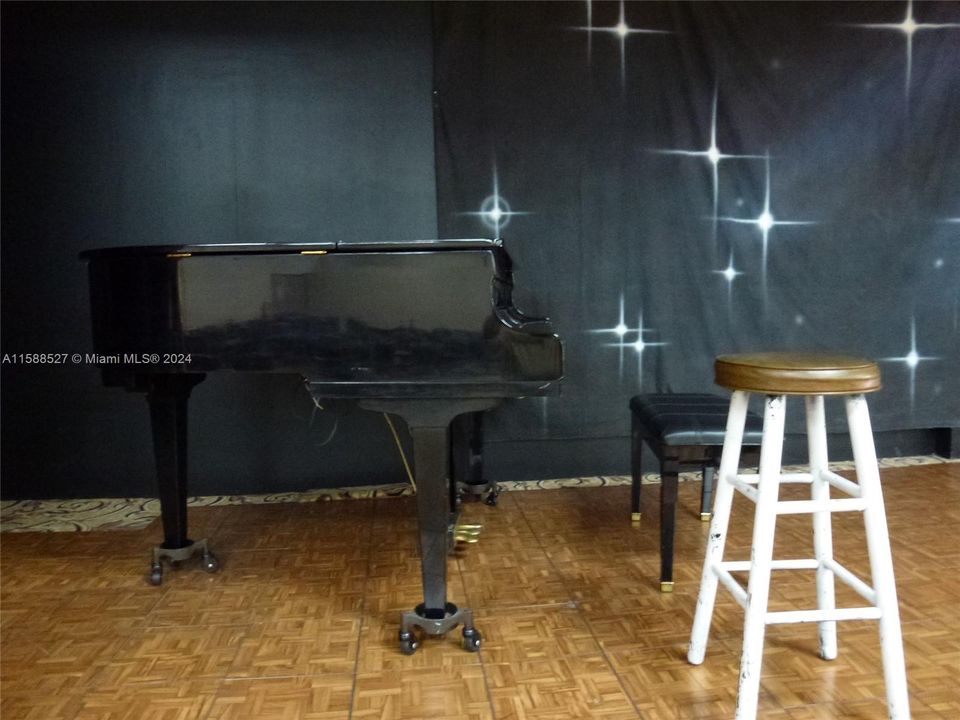 Piano on stage, main clubroom