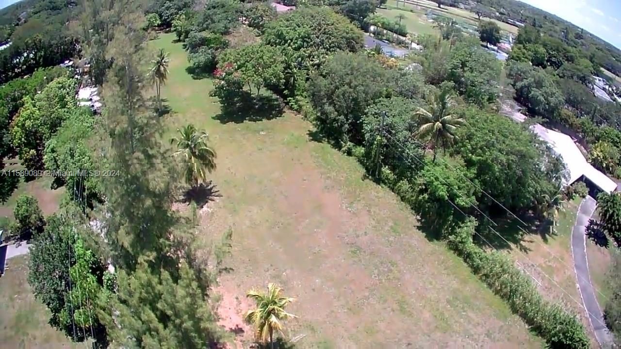 Vacant 1.59 Acre golf course lot available across from Killian Greens. (69,260 sqft lot) . Build your mega Mansion here!