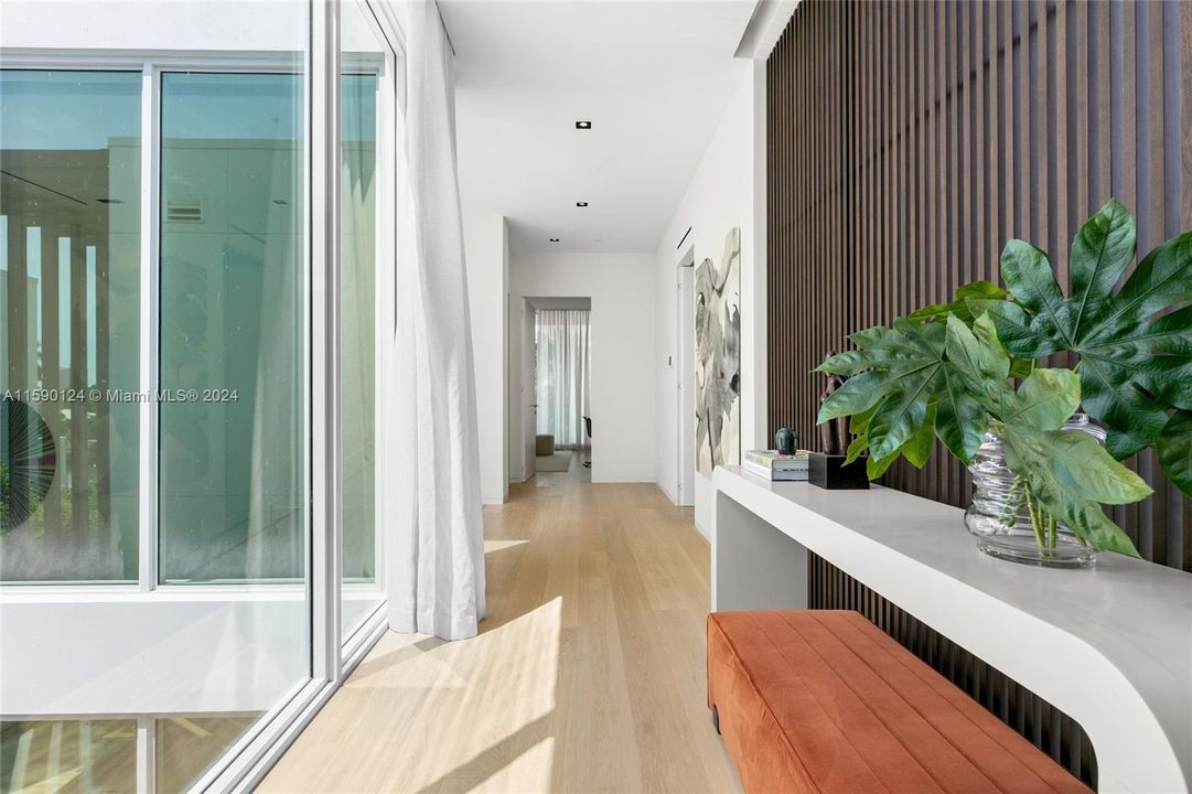 Hallway second floor joining guest bedrooms with primary bedroom at the waterfront villa at the Ritz-Carlton Residences Miami Beach