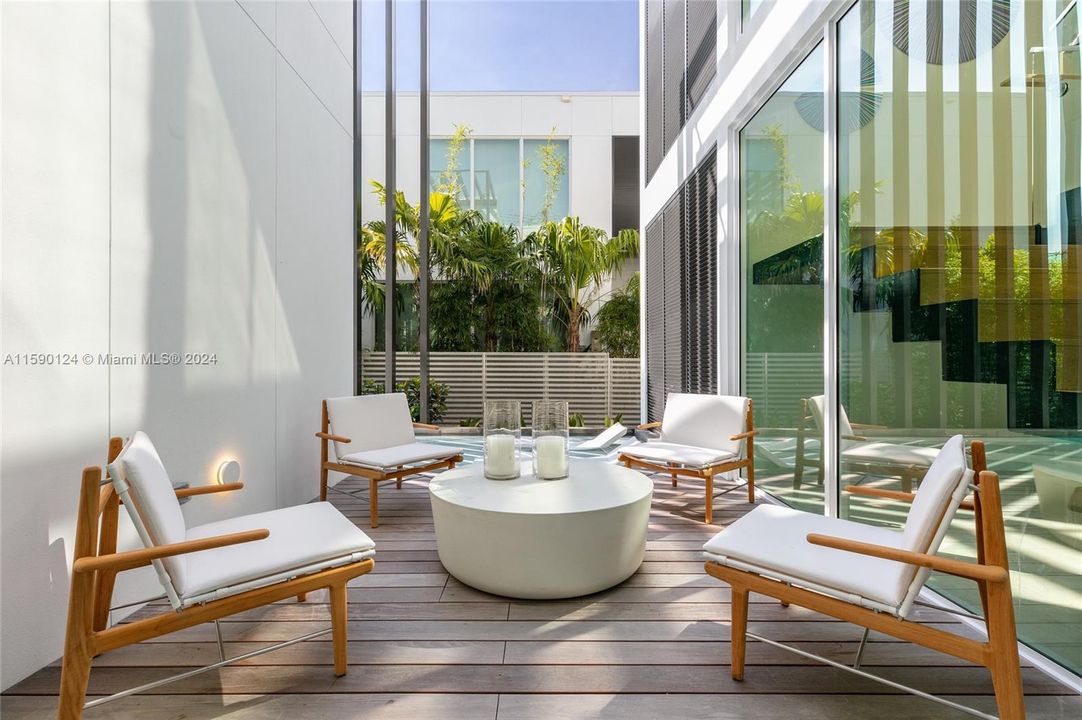 Patio next to tanning ledge at the waterfront villa at the Ritz-Carlton Residences Miami Beach