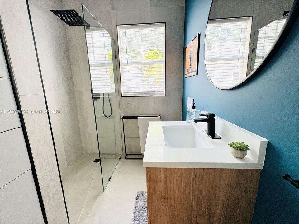 Downstairs bathroom with seamless entry shower