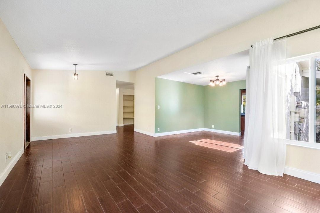 Front room open concept flows to bedrooms and to the kitchen.