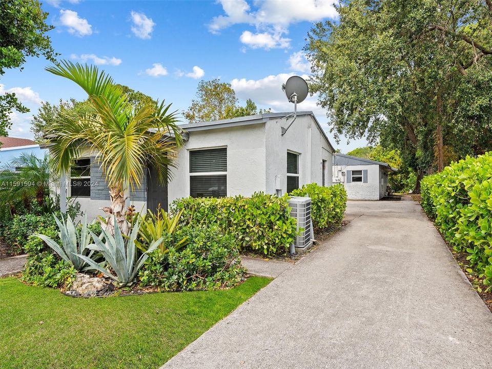 Front house with view of driveway and back house.