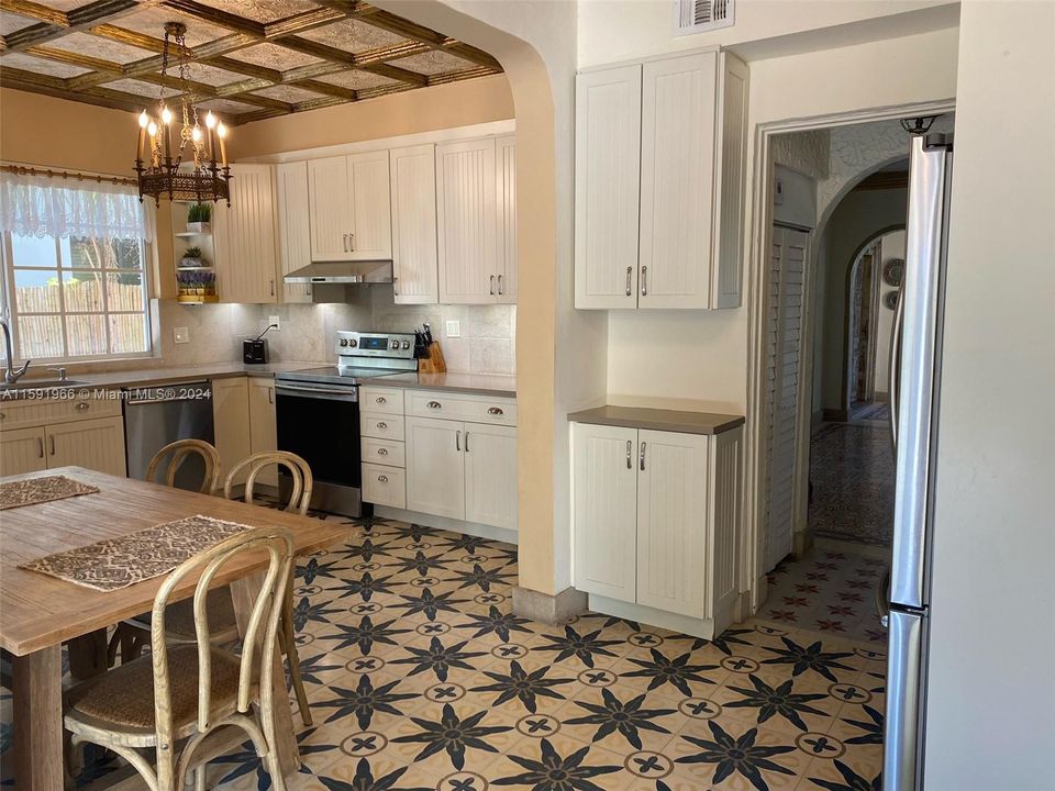 Lots of cabinets for storage and eat-in kitchen.