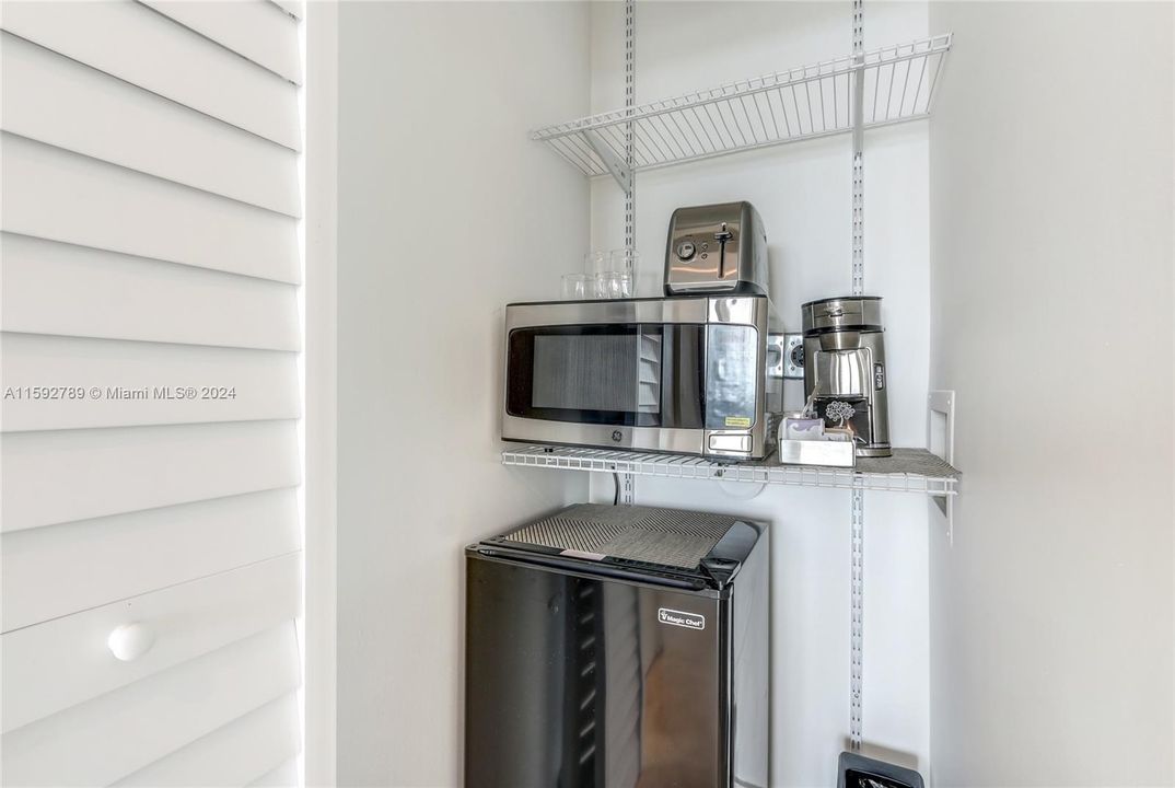 Unit 1011-1 comes with a mini-fridge, mini microwave and coffee machine