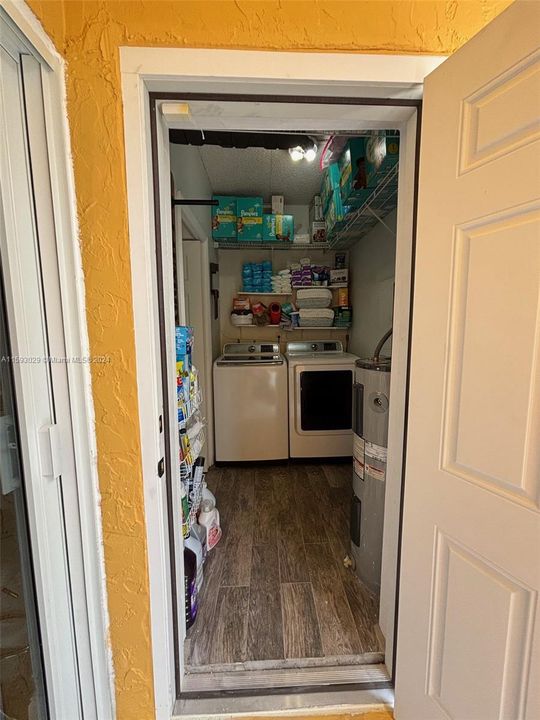 LAUNDRY ROOM VIW FROM COVERED PATIO AREA