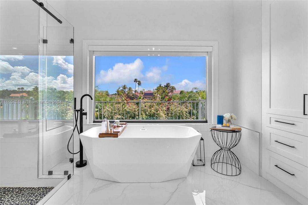 stand alone tub with panorama view of lake