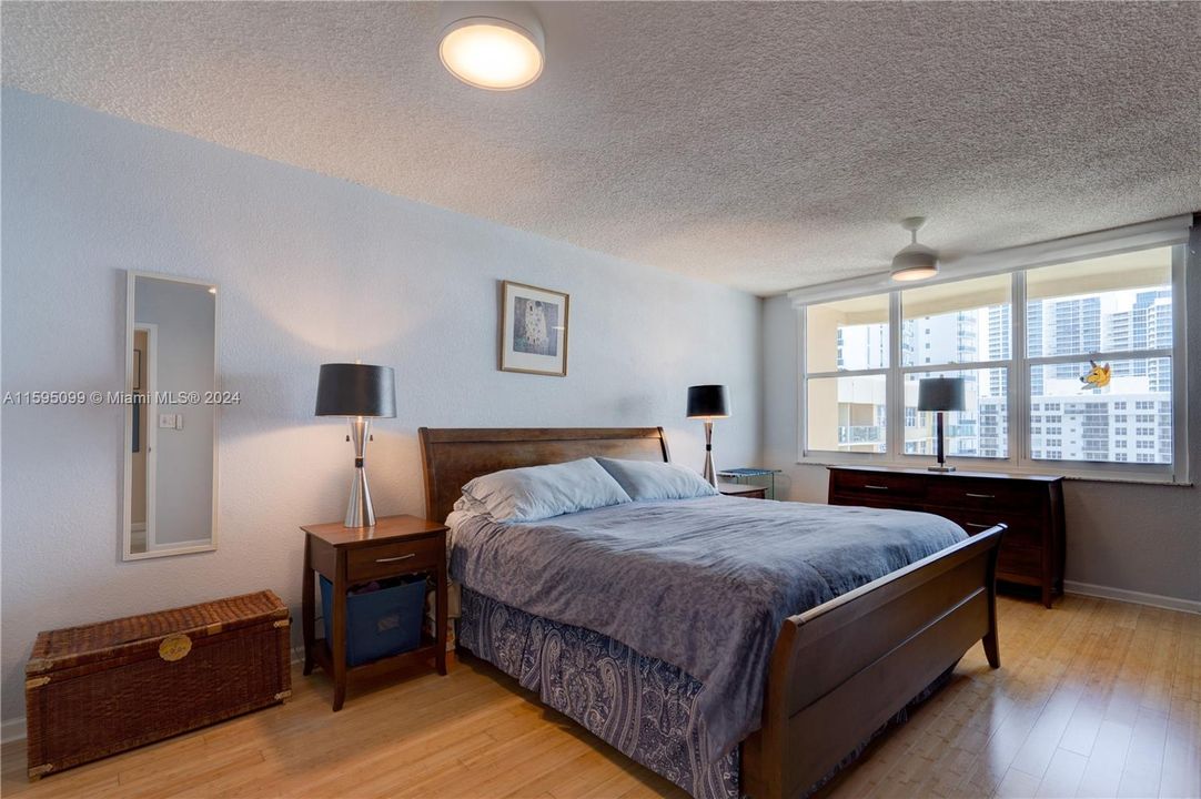 Primary bedroom with views of the water