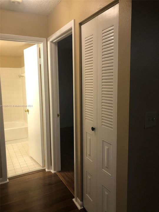 Hallway with linen closet