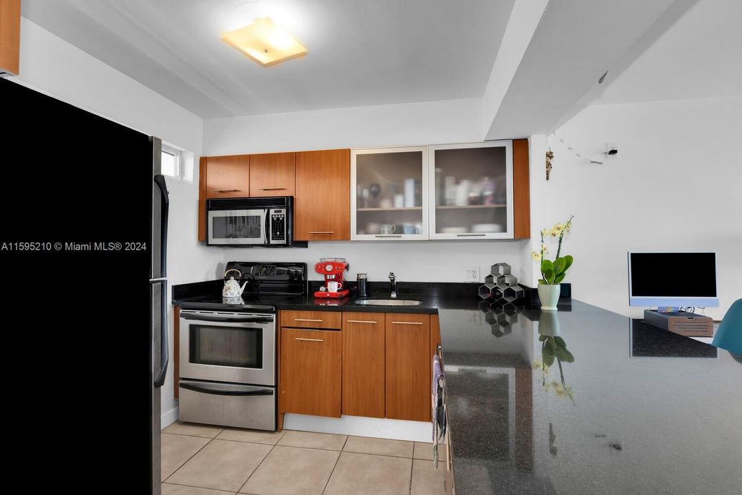 Wonderful large stone countertop. Room for bar stools.