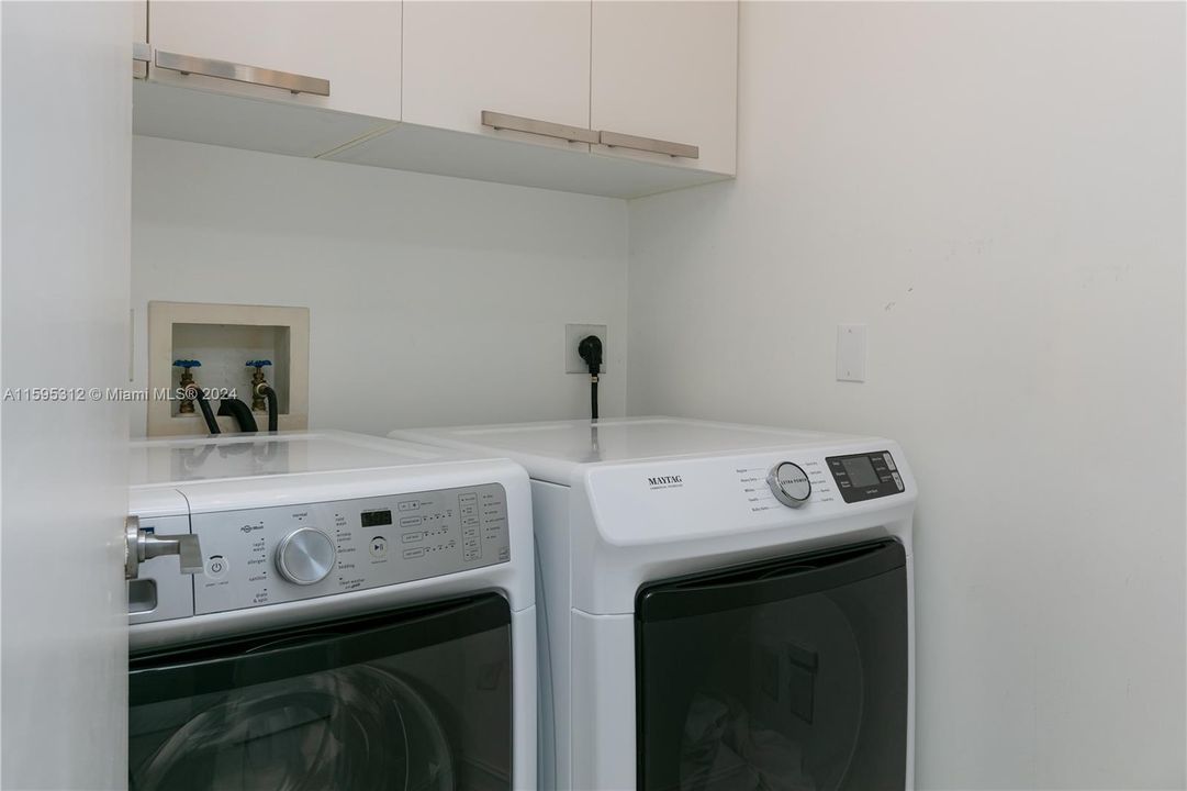 Roomy laundry room equipped with New Washer and Dryer! Combo