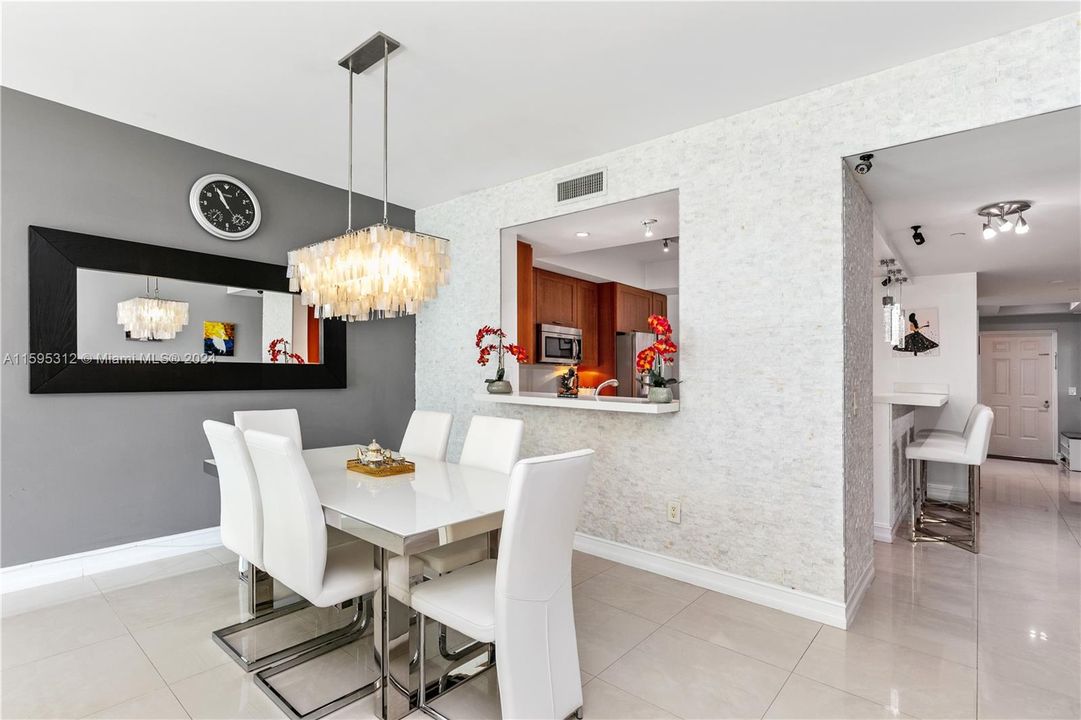 Dining room featuring floor to ceiling marble walls!