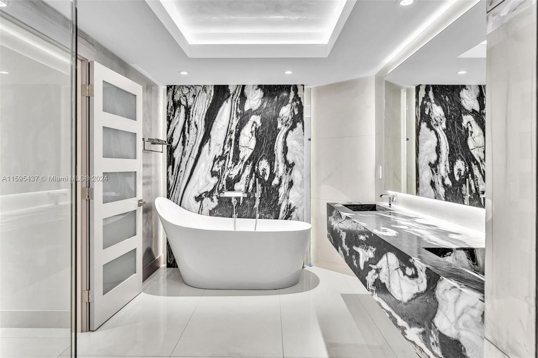 PRIMARY BATHROOM WITH TUB AND SHOWER