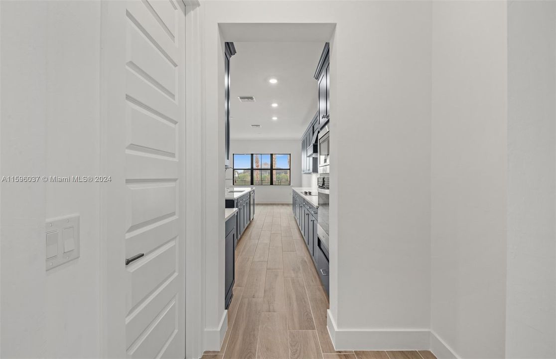 Hallway leading to kitchen from dining room.