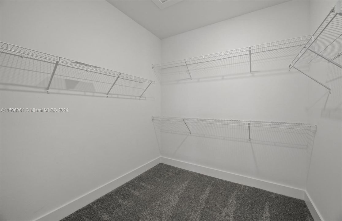 1 of 2 walk-in closets for master bedroom.