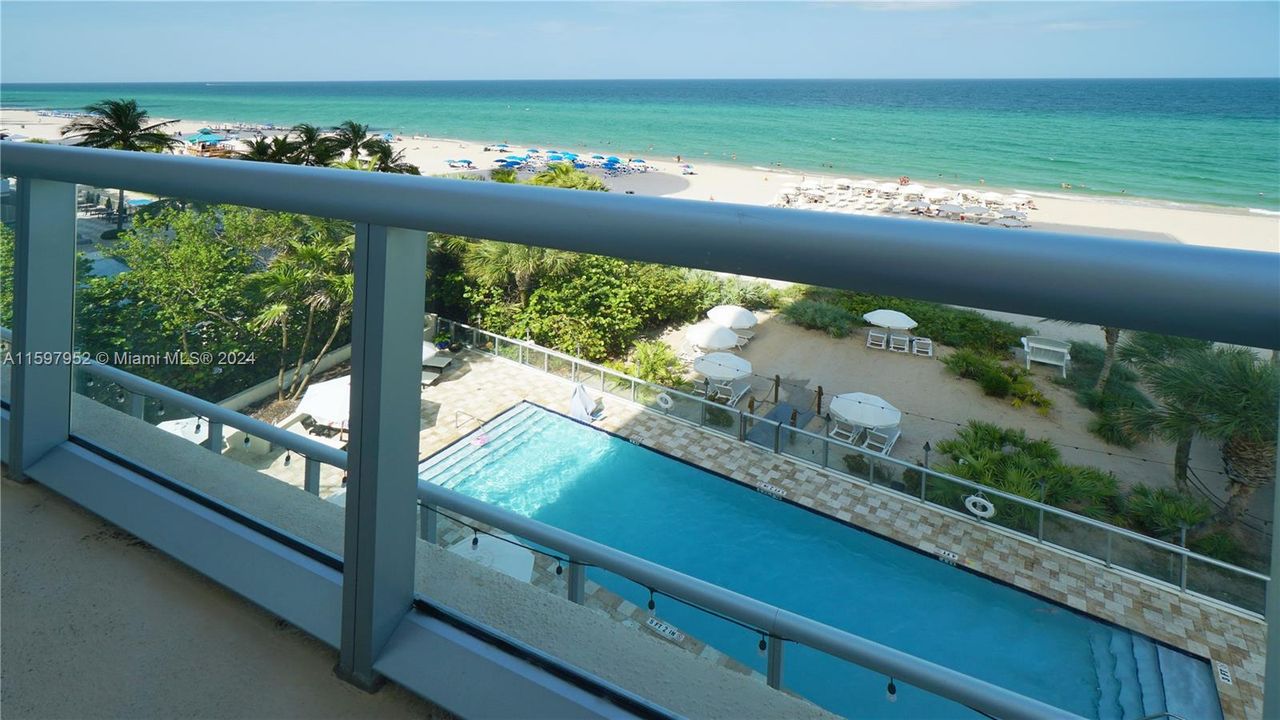 balcony view to the pool and beach
