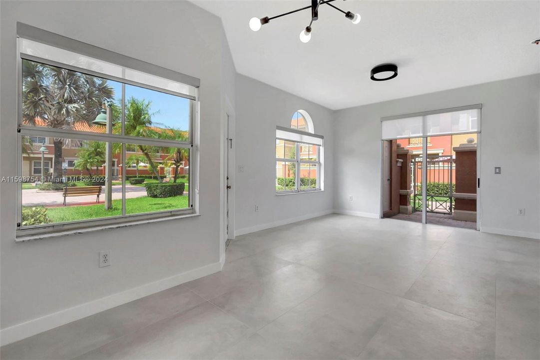 Large windows with roller shades