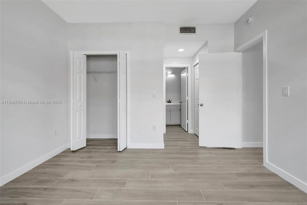 Primary bedroom with three closets