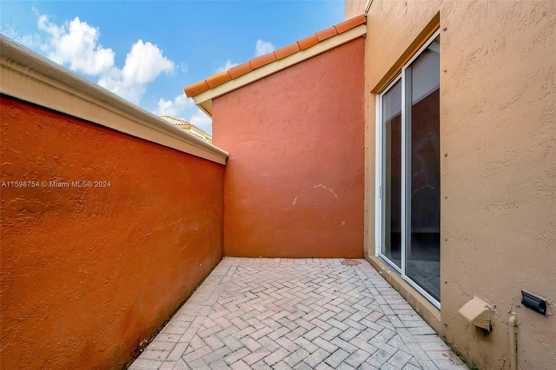 Private patio with entrance to family room