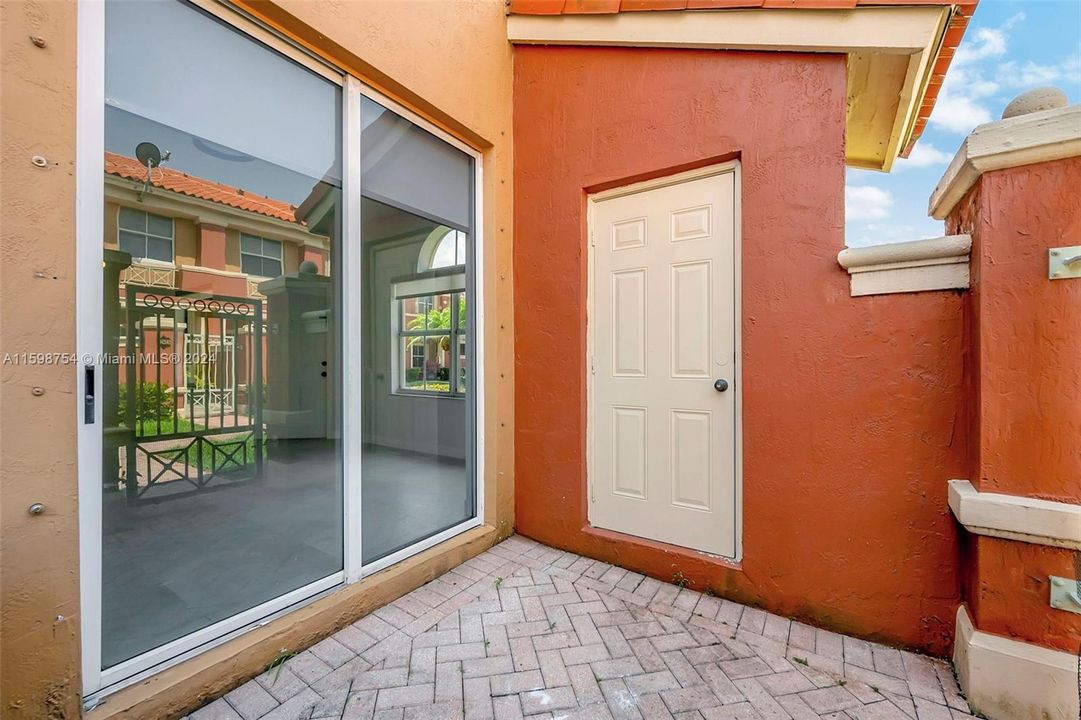 Private patio with storage and entrance to living room