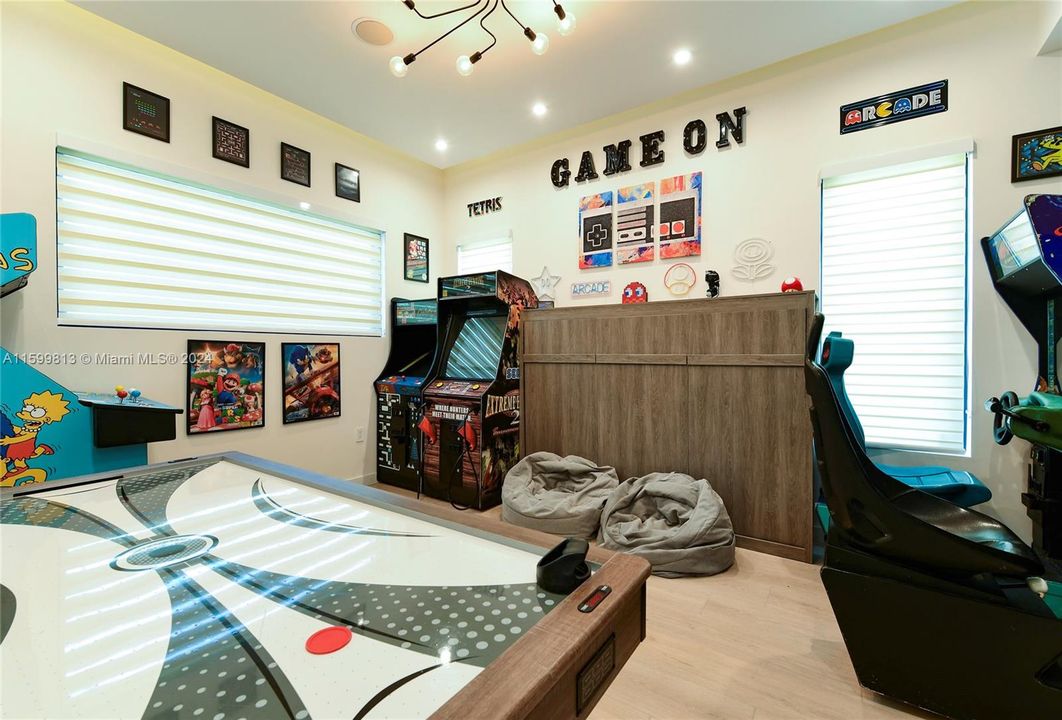 Game Room and Bedroom In One: Let the fun begin in this vibrant game room! Equipped with arcade games and comfortable seating, it's a fantastic space for both kids and adults to unwind and enjoy. And it has a built in Murphy Bed for overnight fun!