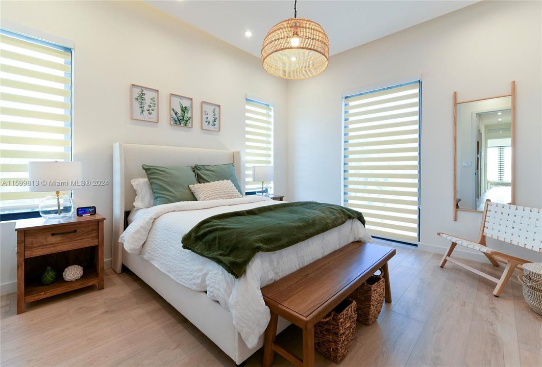 Another Bedroom: This bedroom blends comfort with style, featuring a plush bed, natural light, and soothing colors. It's a perfect sanctuary after a day of sun and sea.