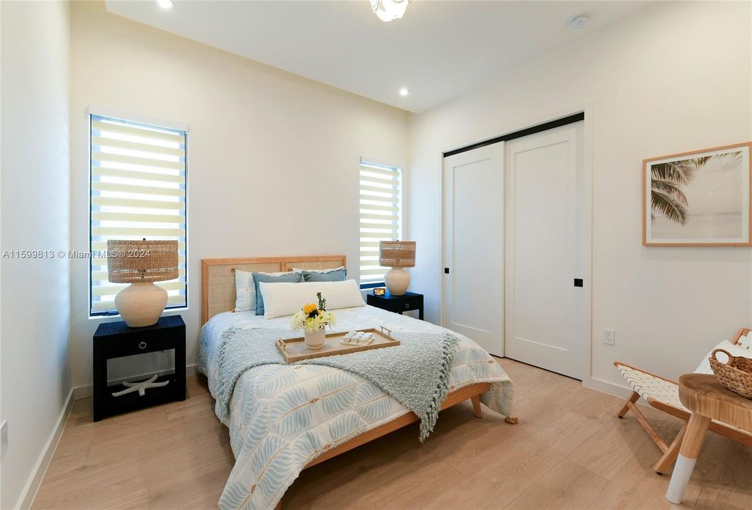 Guest Bedroom: Your guests will feel right at home in this charming bedroom, featuring soft lighting and serene decor. The thoughtful touches and cozy linens promise a restful stay.