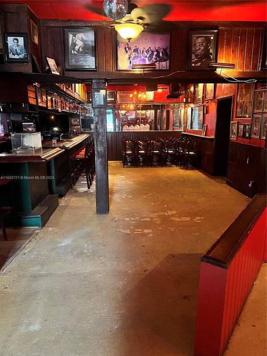 Other side of bar leading to restrooms to the right