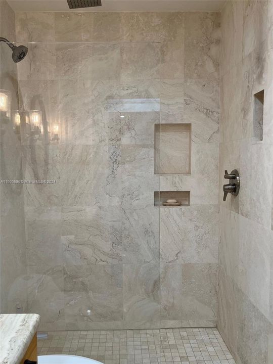 marble and glass walk-in shower