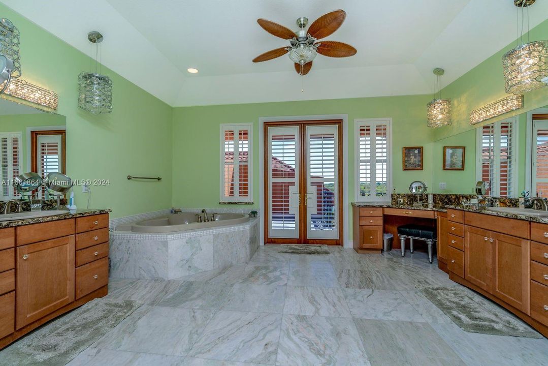 Upstairs master bath with Onyx flooring and private balcony