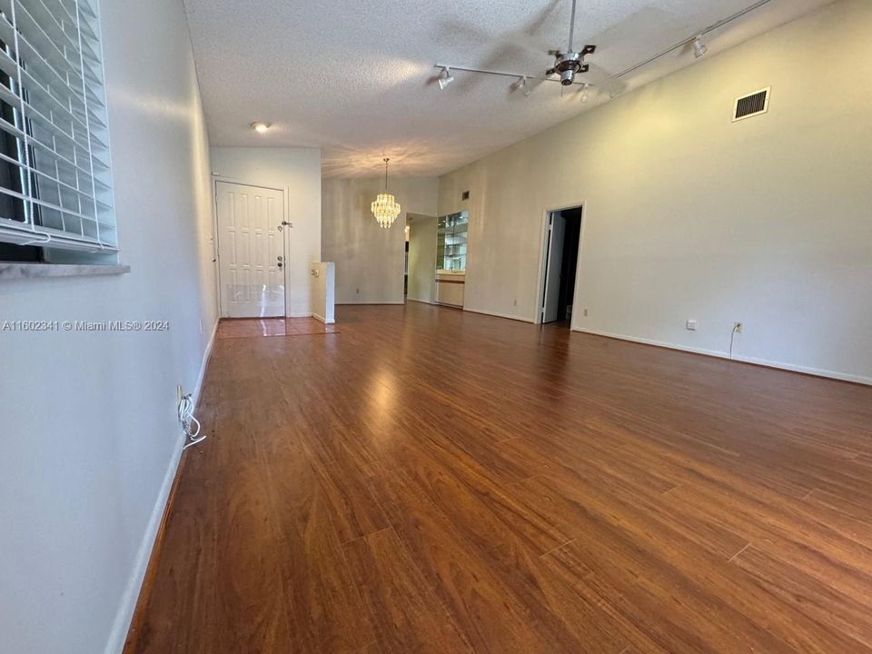 Wood like floors in living areas and all bedrooms.