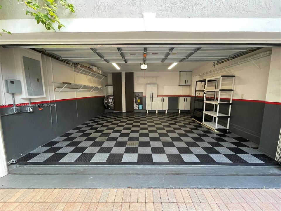 Spacious 2 car garage with vinyl floors and