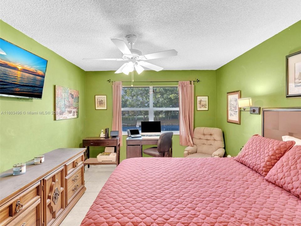 Ample primary bedroom with plenty of closet space, including two closets: one of which is a large walk-in.