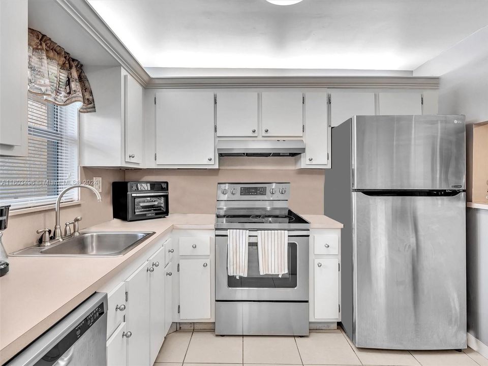 Ample Kitchen, featuring wood cabinets and Stainless Steel appliances