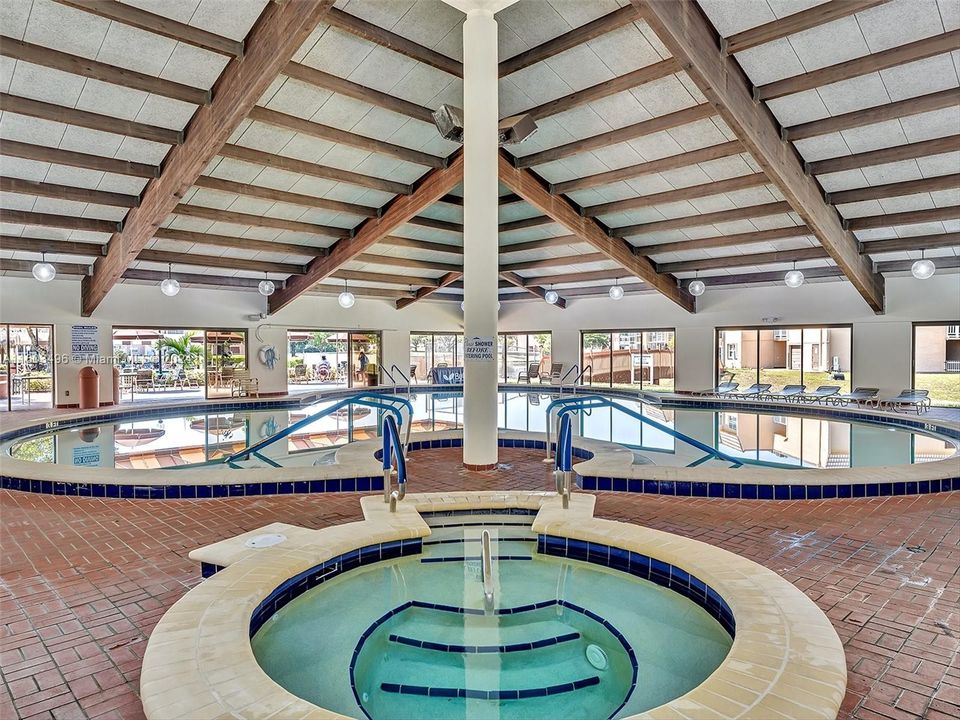 Beautiful clubhouse with plenty of amenities, including indoor and outdoor heated pools, a gym, racquetball and tennis courts, a theater, a billiard room, card rooms, a library, BBQ areas, and more.