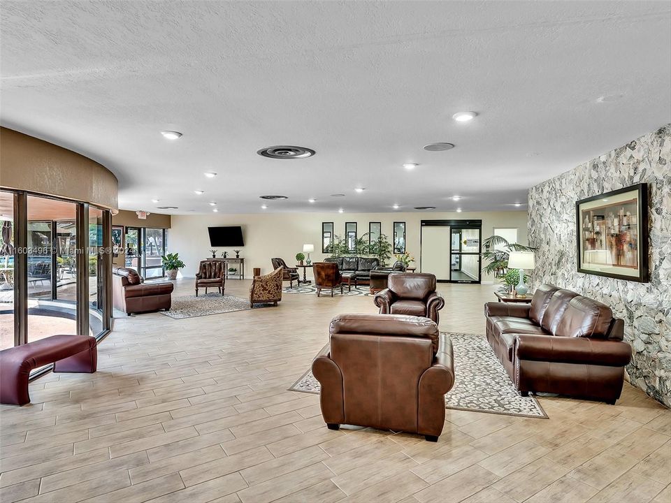 Beautiful clubhouse with plenty of amenities, including indoor and outdoor heated pools, a gym, racquetball and tennis courts, a theater, a billiard room, card rooms, a library, BBQ areas, and more.