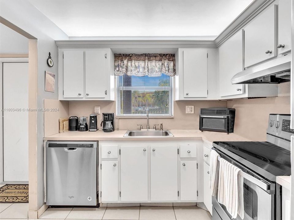 Ample Kitchen, featuring wood cabinets and Stainless Steel appliances