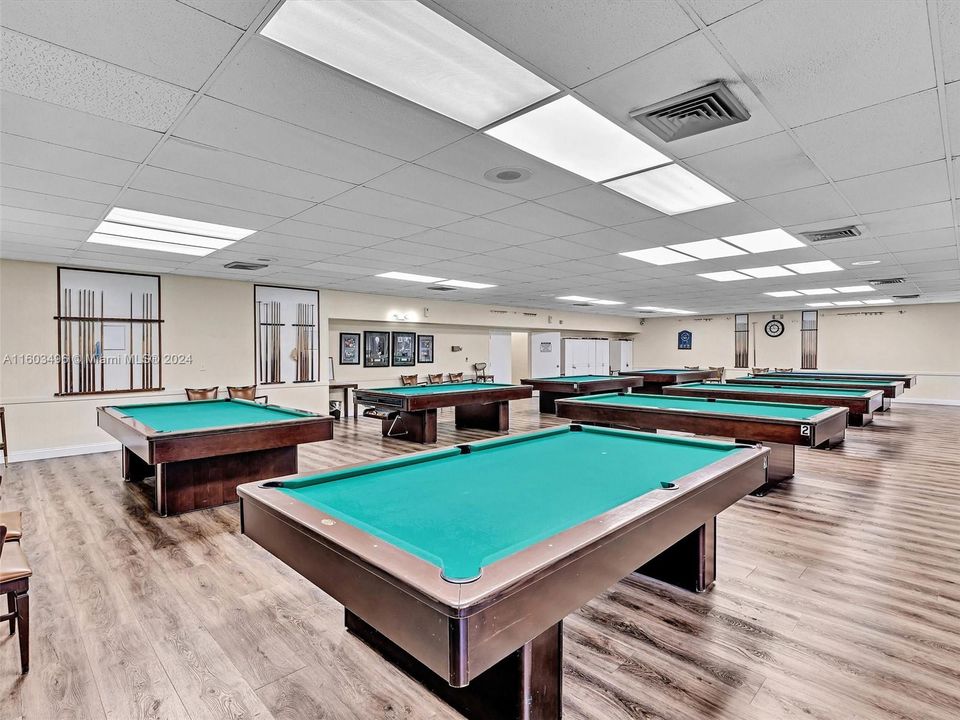 Beautiful clubhouse with plenty of amenities, including indoor and outdoor heated pools, a gym, racquetball and tennis courts, a theater, a billiard room, card rooms, a library, BBQ areas, and more.