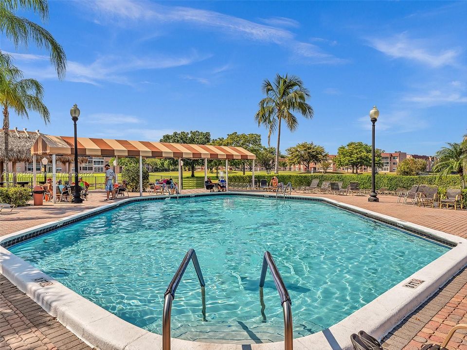 Beautiful clubhouse with plenty of amenities, including indoor and outdoor heated pools, a gym, racquetball and tennis courts, a theater, a billiard room, card rooms, a library, BBQ areas, and more.