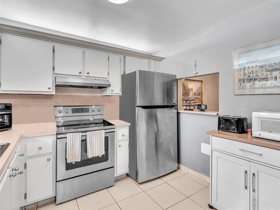 Ample Kitchen, featuring wood cabinets and Stainless Steel appliances