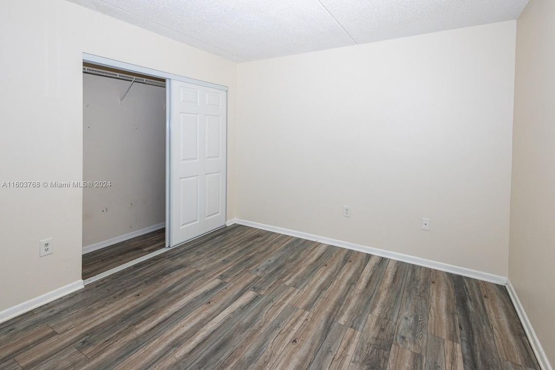 Primary bedroom with closet.