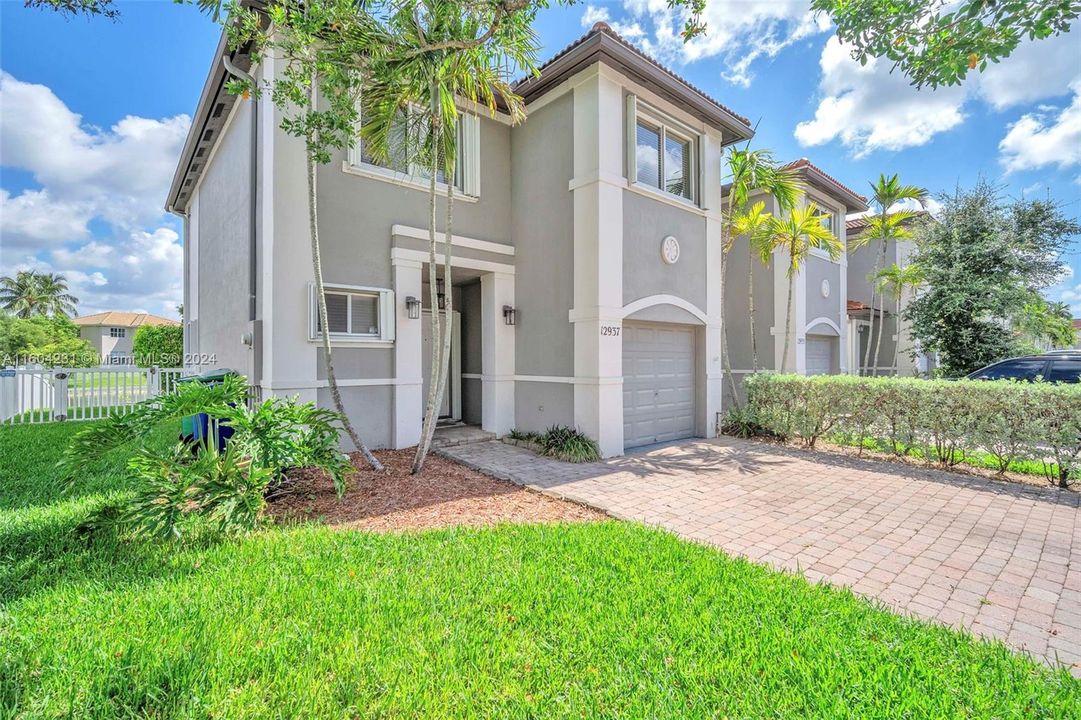 Corner unit, with 1 car garage and room for 2 additional cars on driveway.